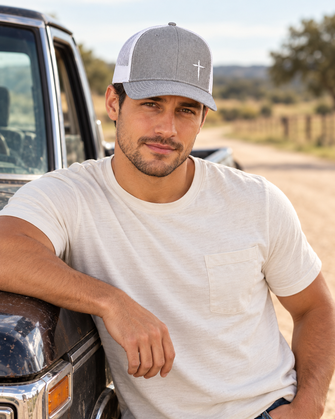 Cross Trucker Hat — Heather Grey / White, worn beside a truck