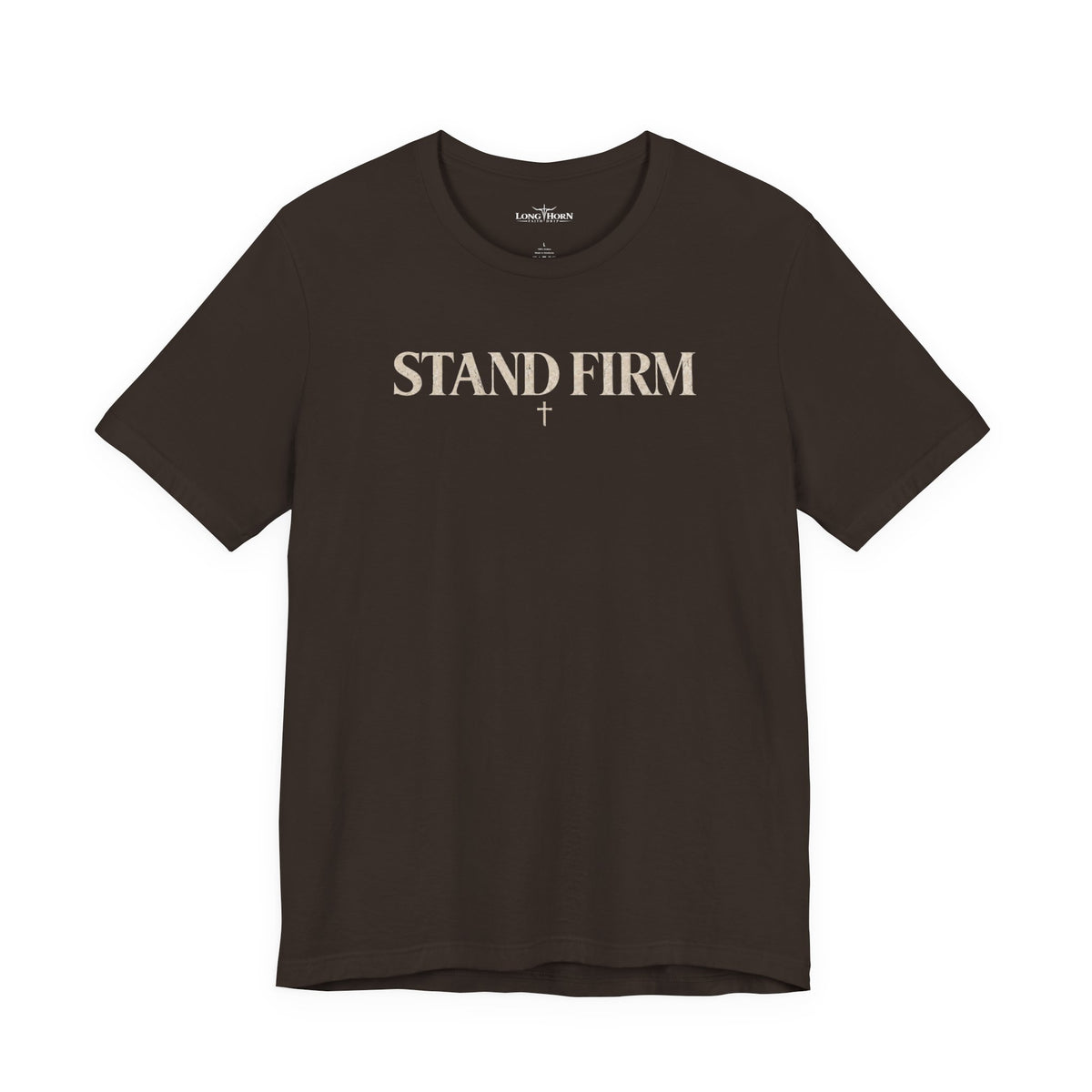 Dark brown tee with STAND FIRM wordmark and small cross on the chest
