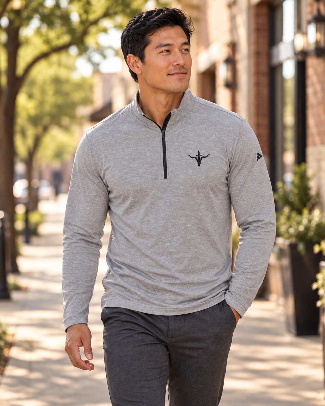 LFD adidas Quarter-Zip — Black Heather, worn on a town sidewalk